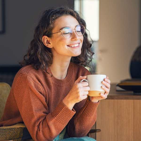 A resident enjoys a morning cup of coffee in her apartment at Mason Avenue, Alexandria, Virginia