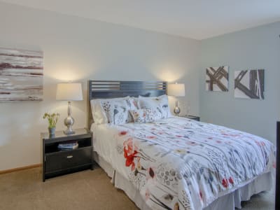 Well-lit bedroom at Gateway Lakes Apartments in Grove City, Ohio