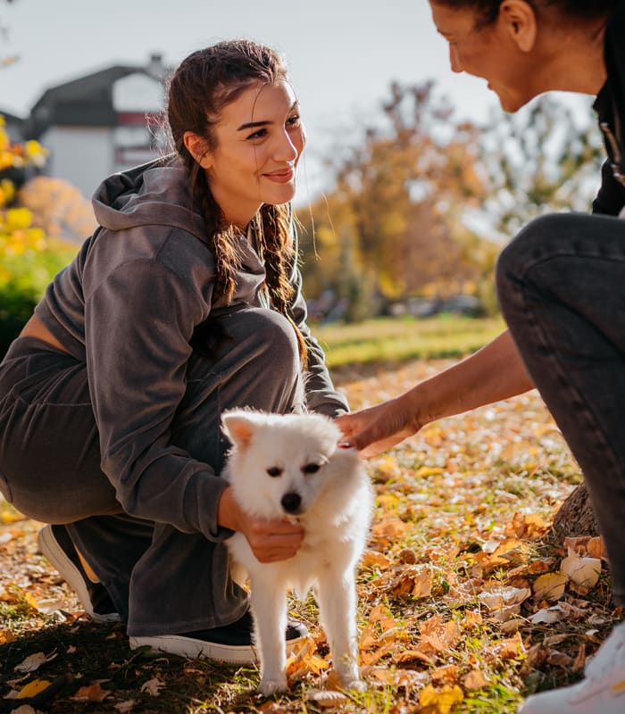 Man and woman holding their dog at Magnolia Row in Oklahoma City, Oklahoma