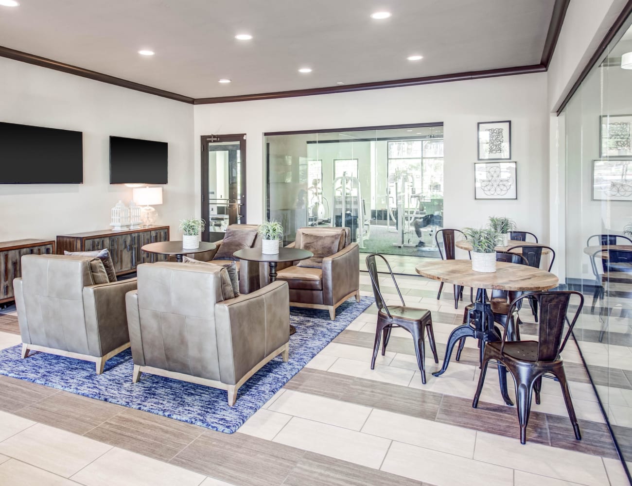 Resident clubhouse with ample seating and more at Beck at Wells Branch in Austin, Texas