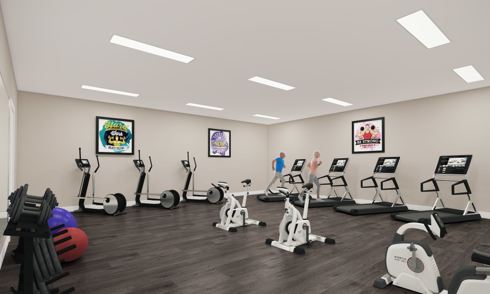 Resident exercise room with various workout equipment at Keystone Place at Magnolia Commons in Glen Carbon, Illinois