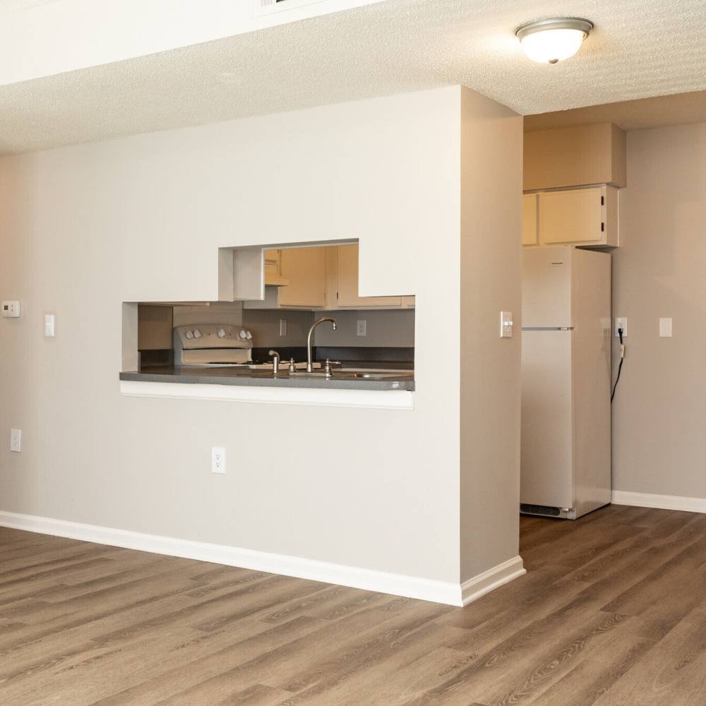 Living room with view to kitchen at West Village Apartments in Hillsborough, North Carolina