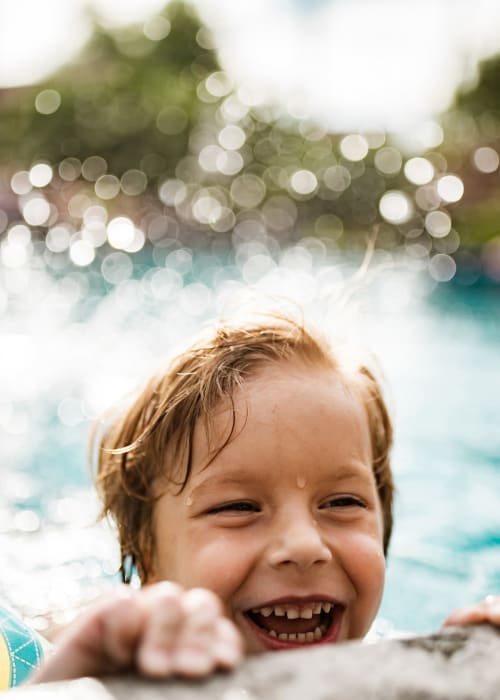 Child in the pool at Regency at Johns Creek Walk in John's Creek, Georgia