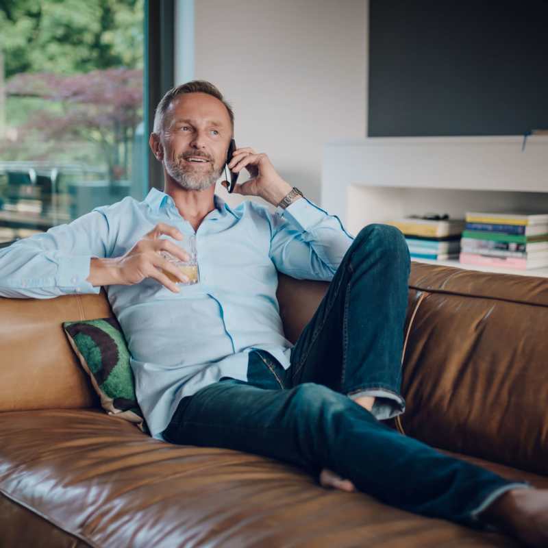 A resident relaxes in his apartment at Acclaim at Cary Pointe, Cary, North Carolina