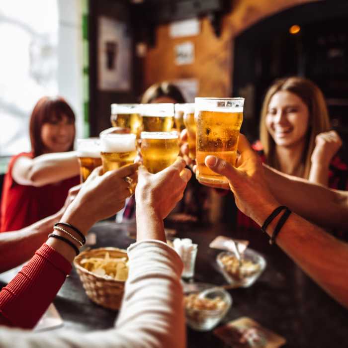Resident friends enjoying a beer at a local craft brewery near The Morgan in Bedford, Texas