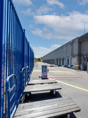 Push carts lining the fence at Nova Storage in Mission Hills, California