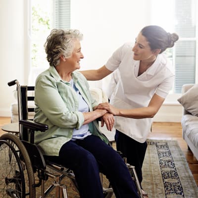Resident and caregiver at a community by Cascade Senior Living Services