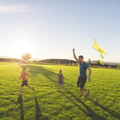 Resident and his kids having fun in local park near Fifteen in Miami, Florida