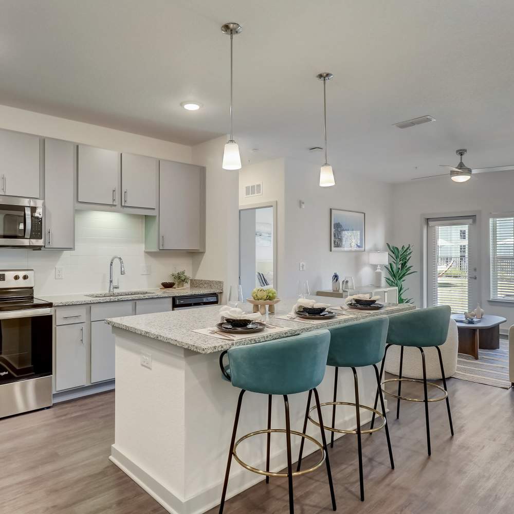 An apartment kitchen with an island  at Seaton Preserve in Jacksonville Florida