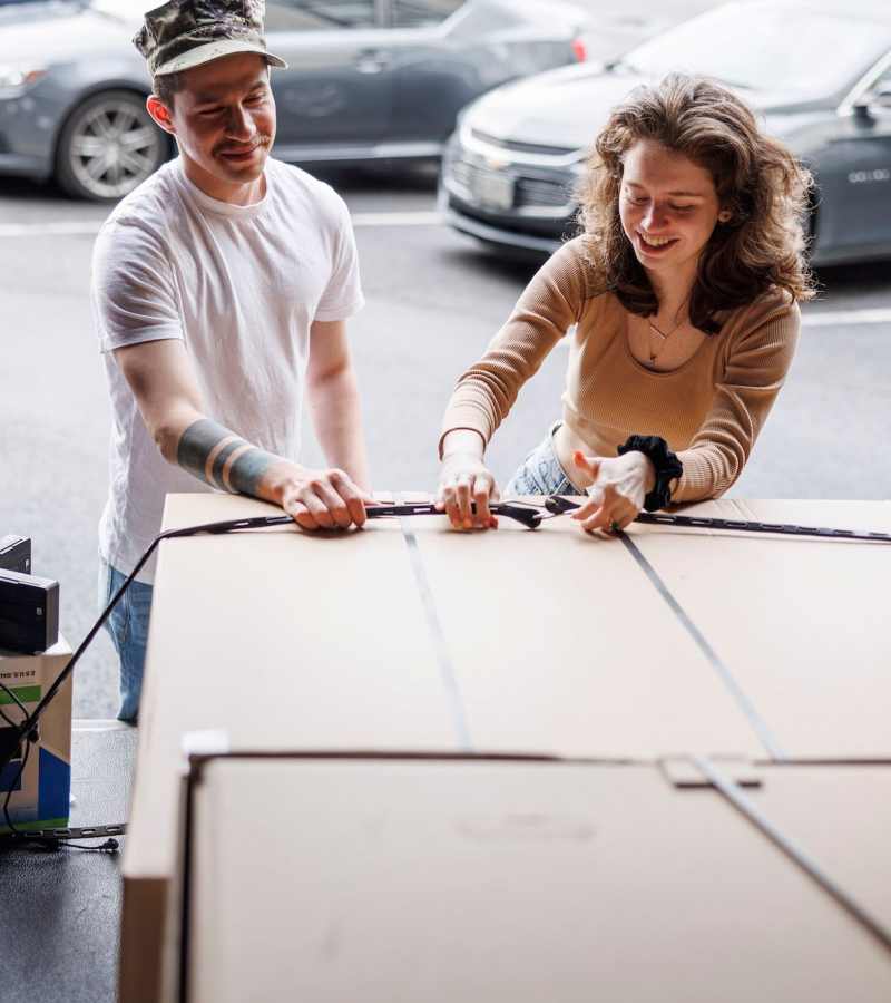 A couple unloading a truck at CSI Mini Storage Tacoma in Tacoma, Washington