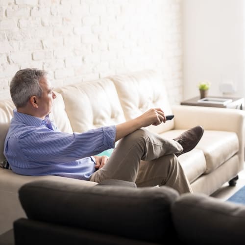 A resident watching tv at On Base Housing in Yuma, Arizona