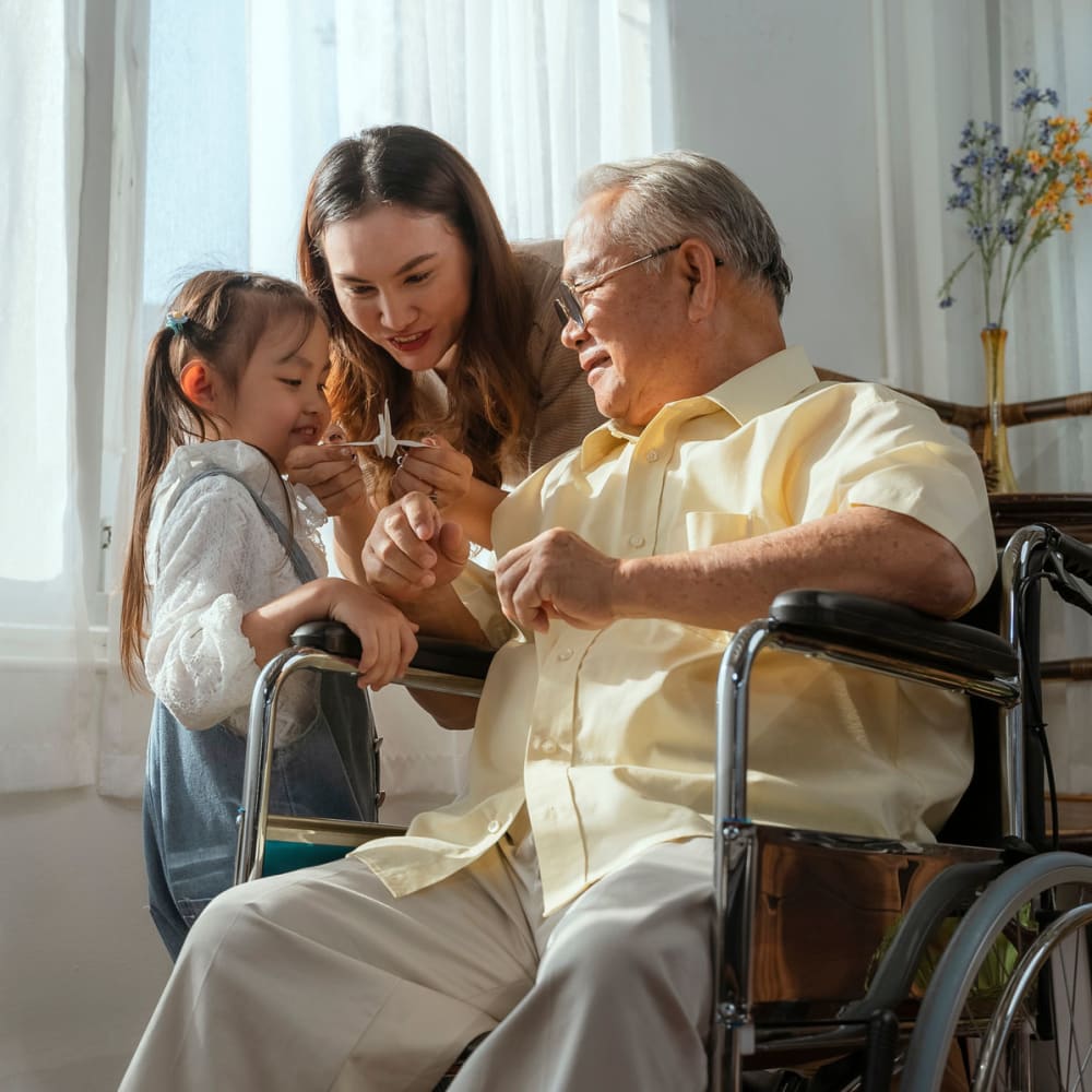 A resident and his grandchildren at Greenfield Estates in Akron, Ohio