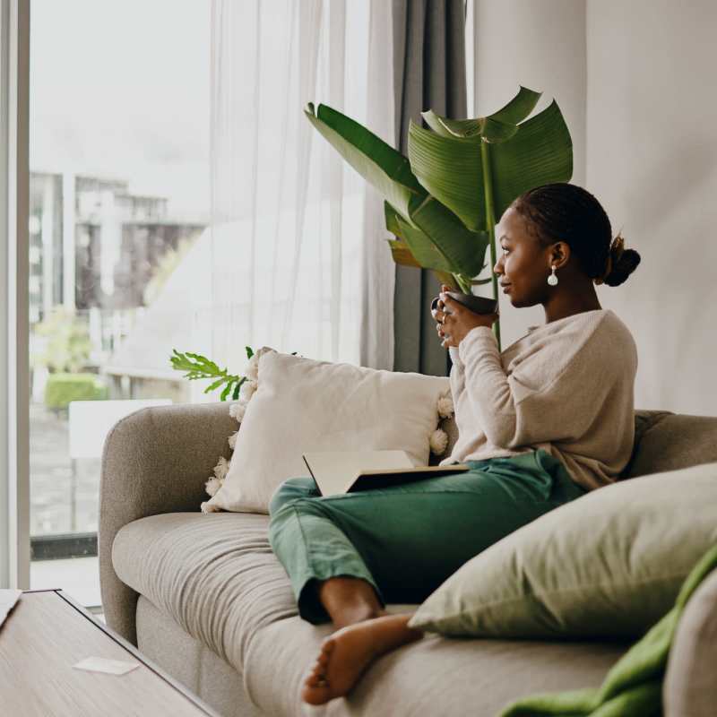 A resident enjoys a cup of coffee in her apartment at Palmer's Creek, Fredericksburg, Virginia