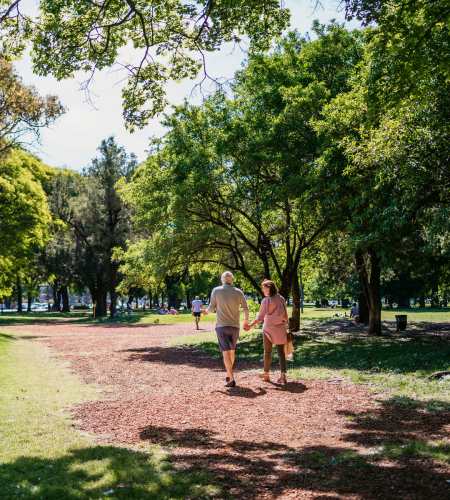 A couple walking at park near Mamook Tokatee in Portland, Oregon
