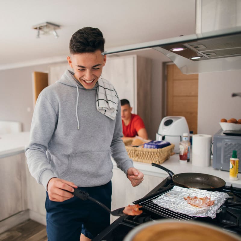 student making breakfast at home at The Social in Lutz, Florida