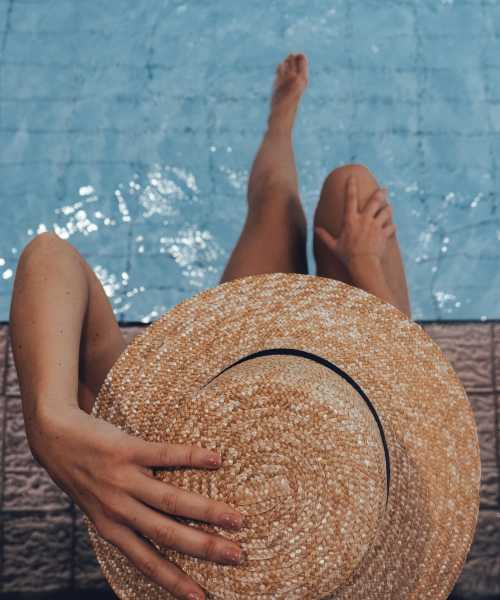 Resident woman by the pool at Calder in Round Rock, Texas