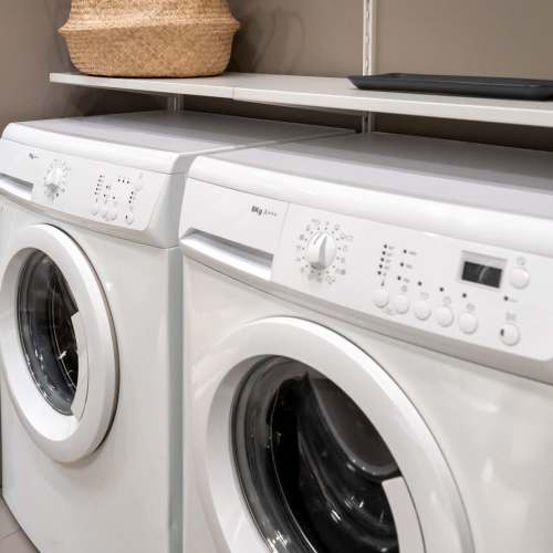 Two white washing machines side by side at Zacharys Crossing in Washington Court House, Ohio