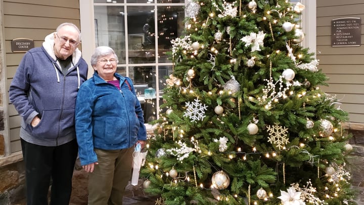 An Arbour Square (PA) couple takes a photo by the brand new holiday tree!