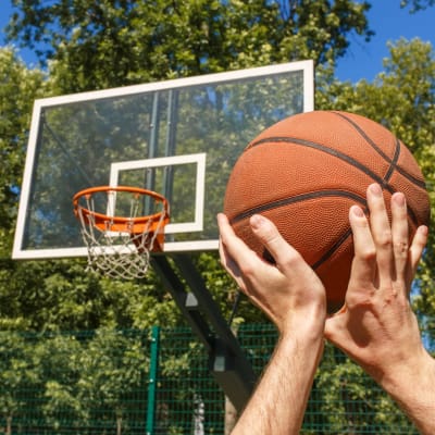 A resident playing basketball at Seal Beach Officer Housing in Seal Beach, California