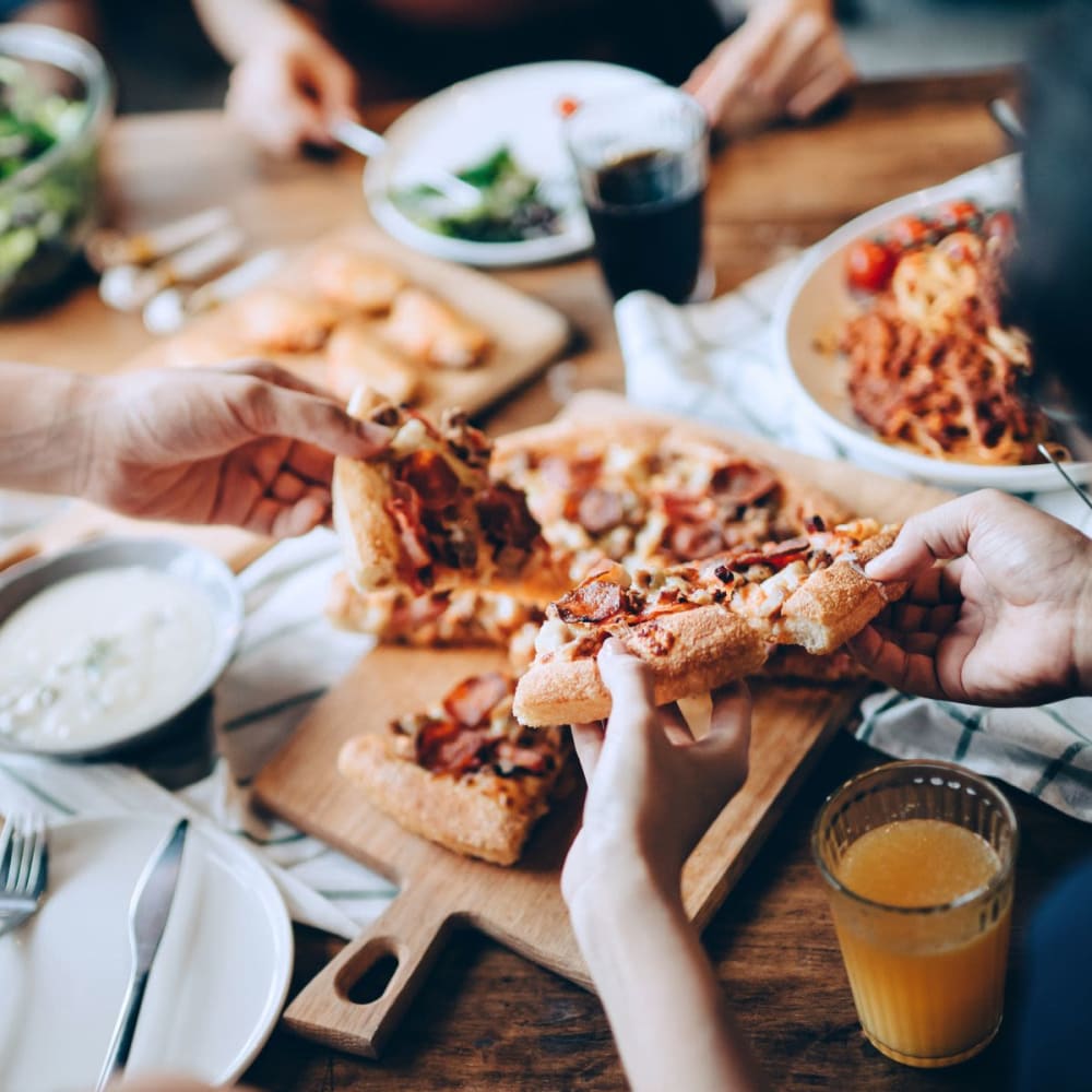 Residents eating pizza near Veridian in Cincinnati, Ohio