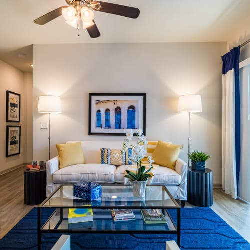 Model living room with ceiling fan at The Carlton at Bartram Park in Jacksonville, Florida