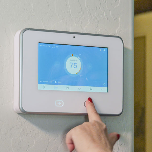 Electronic thermostat in model home at Christopher Todd Communities at Country Place in Tolleson, Arizona