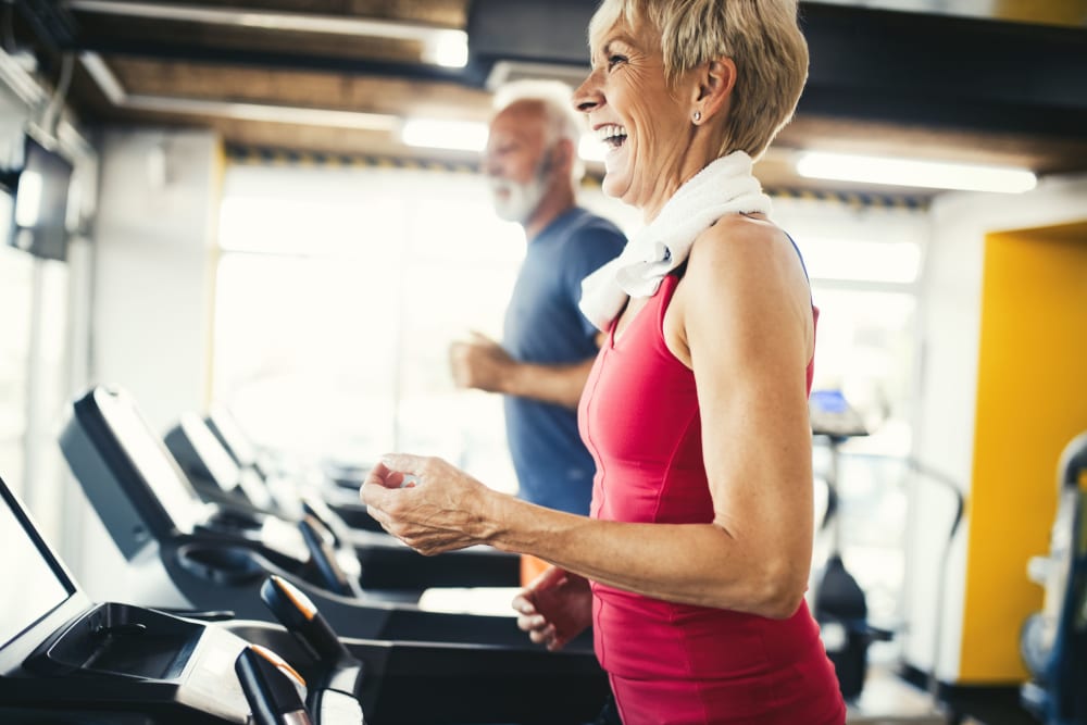Residents jogging in the fitness center at Spokane at Rainier Court in Seattle, Washington