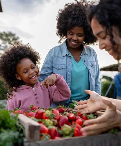 Resident buying fresh fruits near Palm Beach Preserve in West Palm Beach, Florida