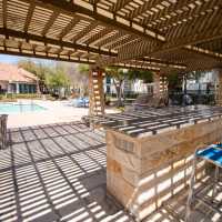 Poolside cabana with shaded seating at Sutton in Austin, Texas