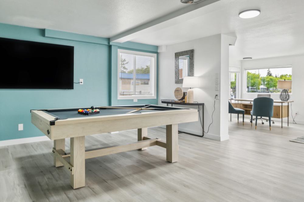 Pool table and work spots in clubhouse at Cascade Ridge in Tacoma, Washington