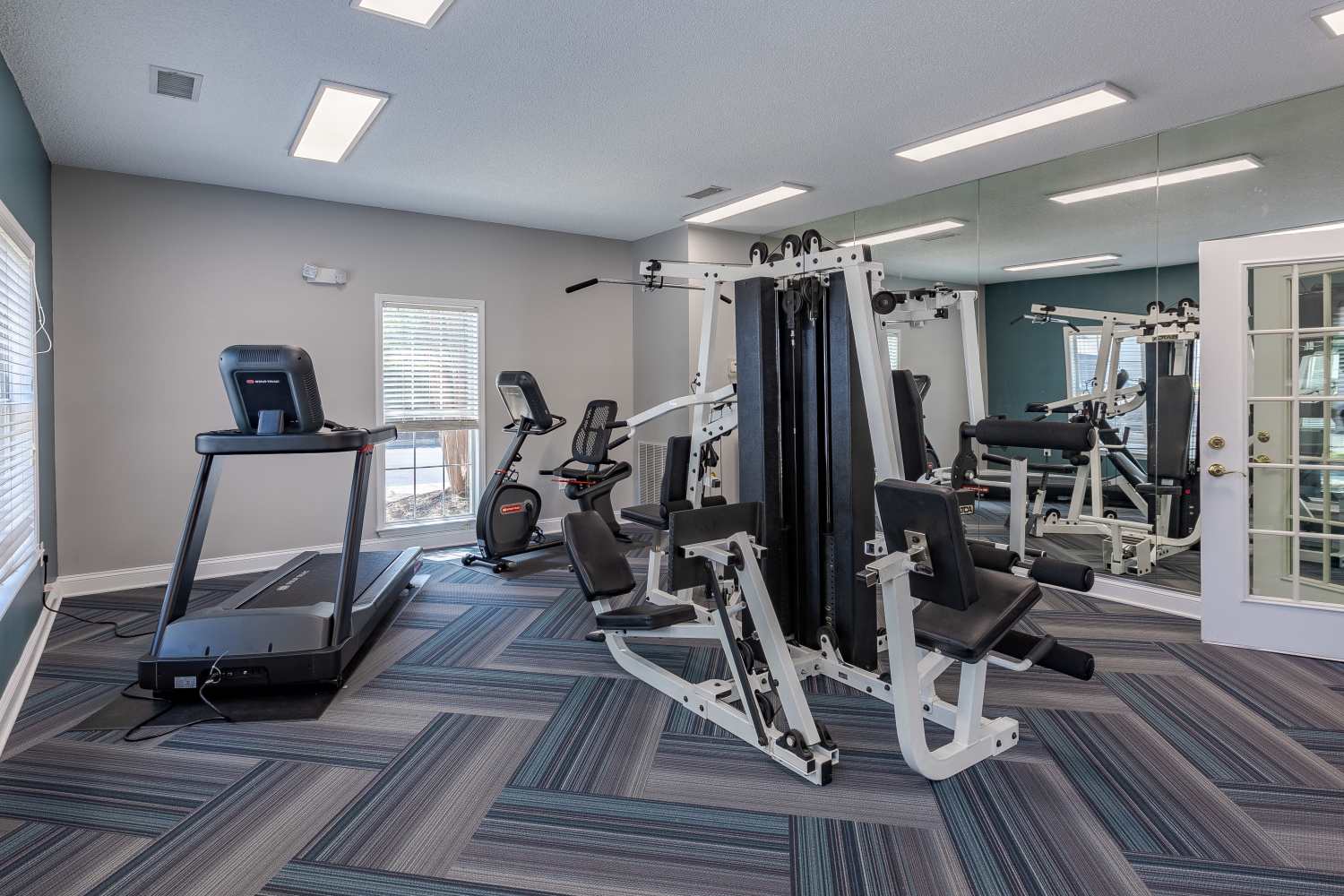 Resident clubhouse with a fitness center at The Waterway Apartment Homes in Lexington, South Carolina