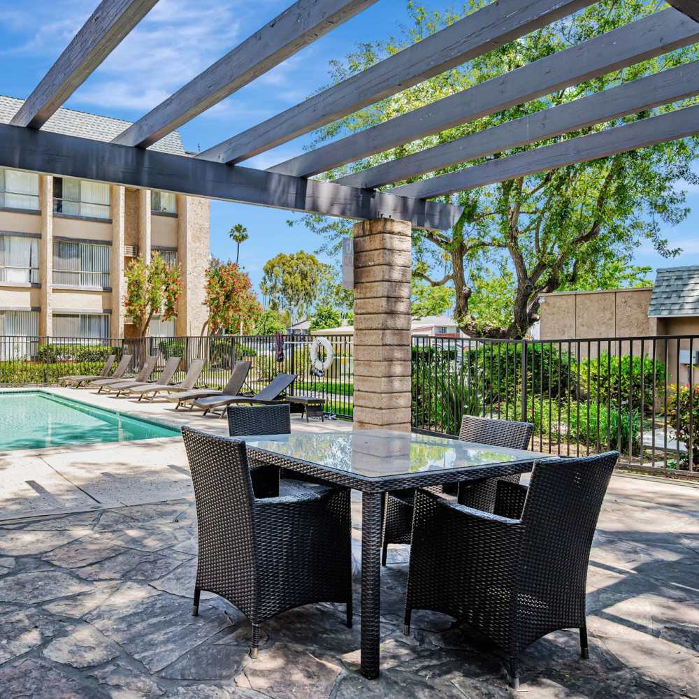 Swimming pool with grassy lawn near  at Independence Park Apartments in Canoga Park, California