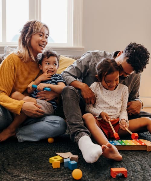 Family in their living room at Magnolia Court in Orlando, Florida