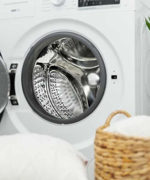 Bright laundry room with modern washer at Clarkwood Greens in Warrensville Heights, Ohio