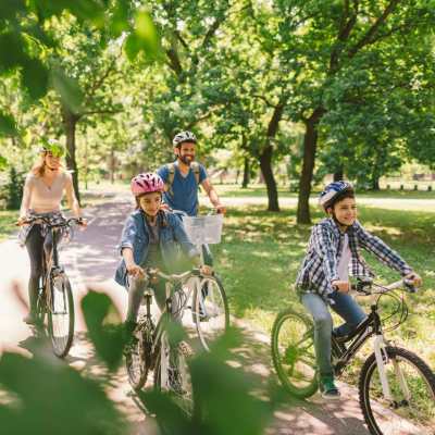 Family cycling in the neighborhood near Breckinridge Point Apartments in Richardson, Texas