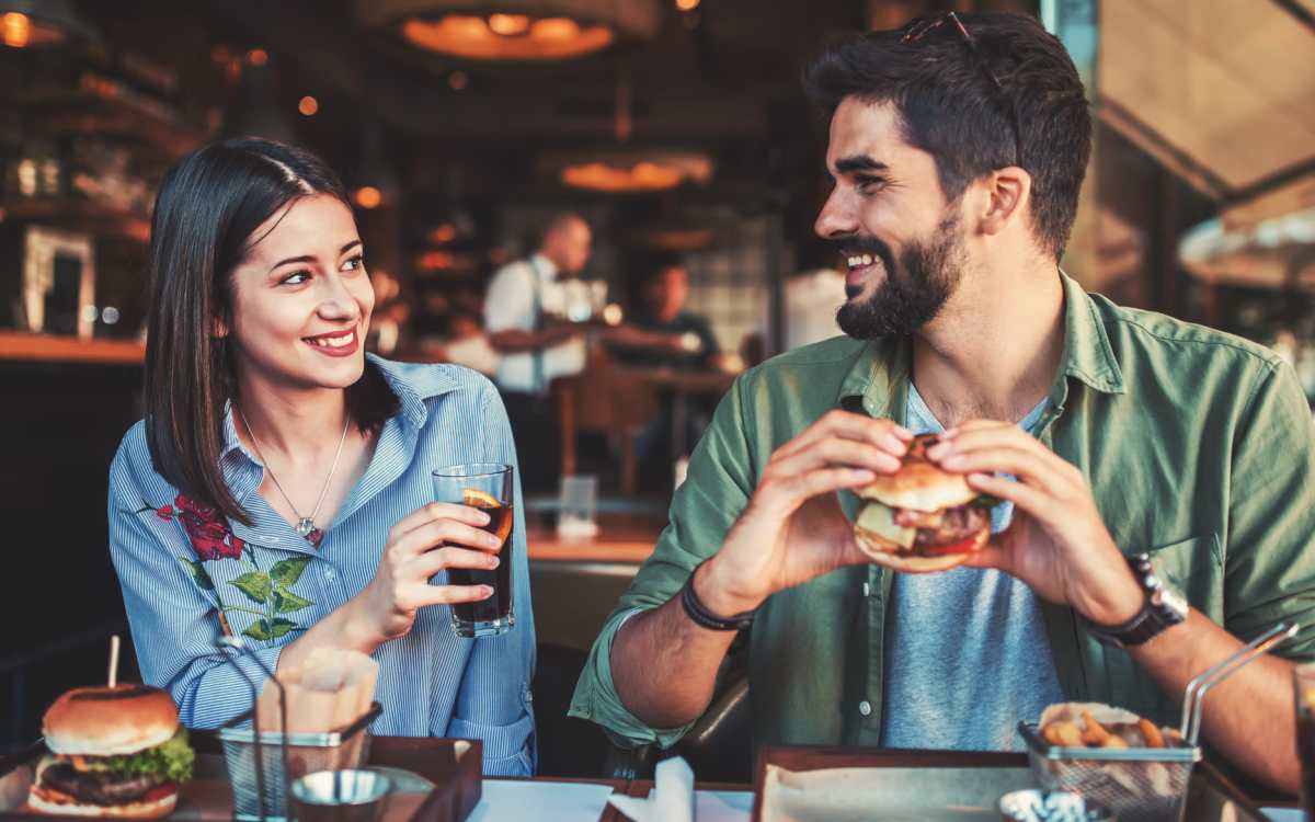 Resident couple enjoying a meal at a local restaurant near Heather Hill Apartments in Temple Hills, Maryland