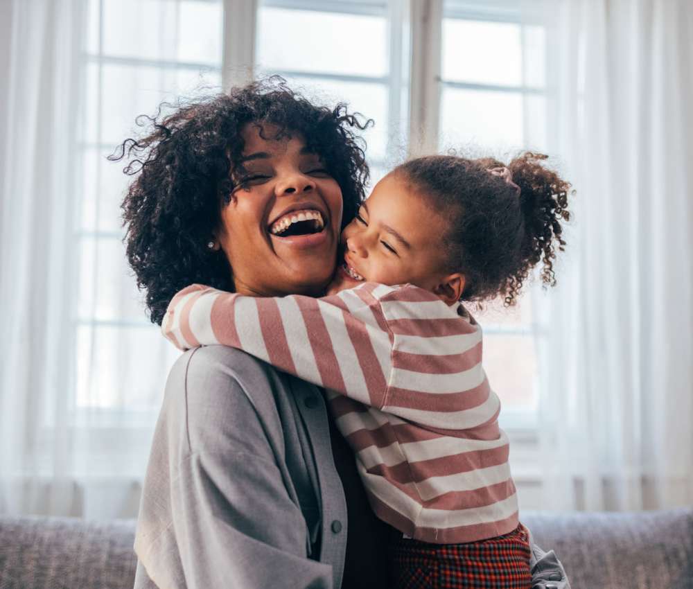 Resident with her daughter laughing at Gateway Hills in Ames, Iowa
