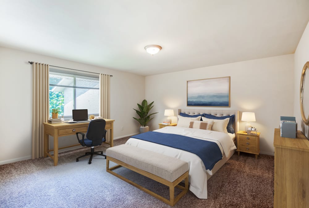 Staged bedroom with wall to wall carpeting at Harbor Place Apartment Homes in Fort Washington, Maryland