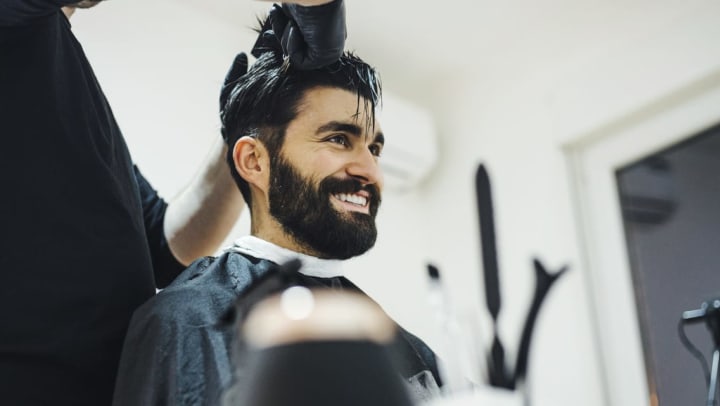 Man getting a professional haircut at a salon | salons in Brunswick