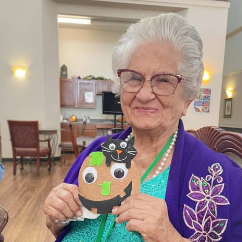 A resident with art project at Canoe Brook Assisted Living in Broken Arrow, Oklahoma