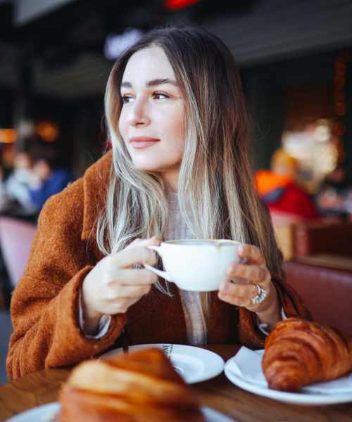 Resident having coffee at a cafe near Rivercrest in Waco, Texas