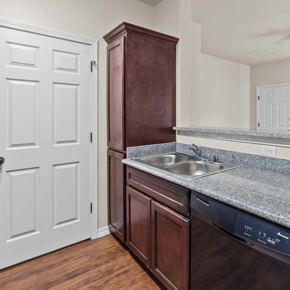 Kitchen with granite countertops at Las Torres Apartments in El Paso, Texas