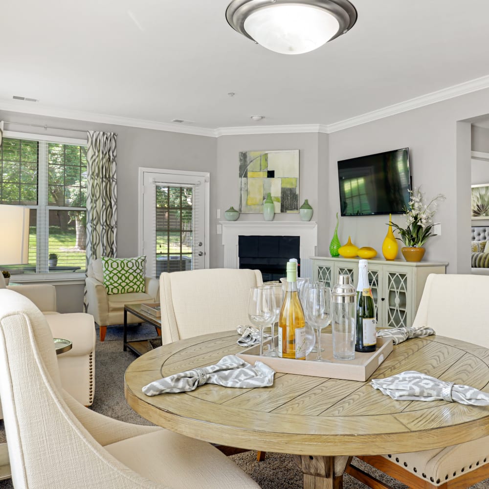 Dining room seating in an apartment at The Courts of Avalon in Pikesville, Maryland