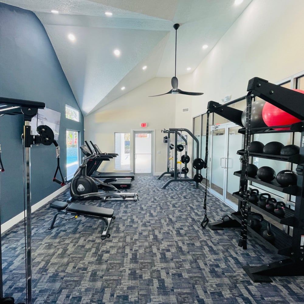 Fitness center with treadmills at Atlas at Winter Park in Winter Park, Florida