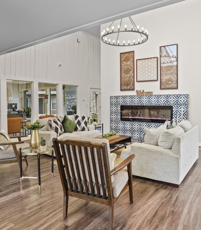 Lounge area with fireplace at Aspen Park Apartments in Wichita, Kansas