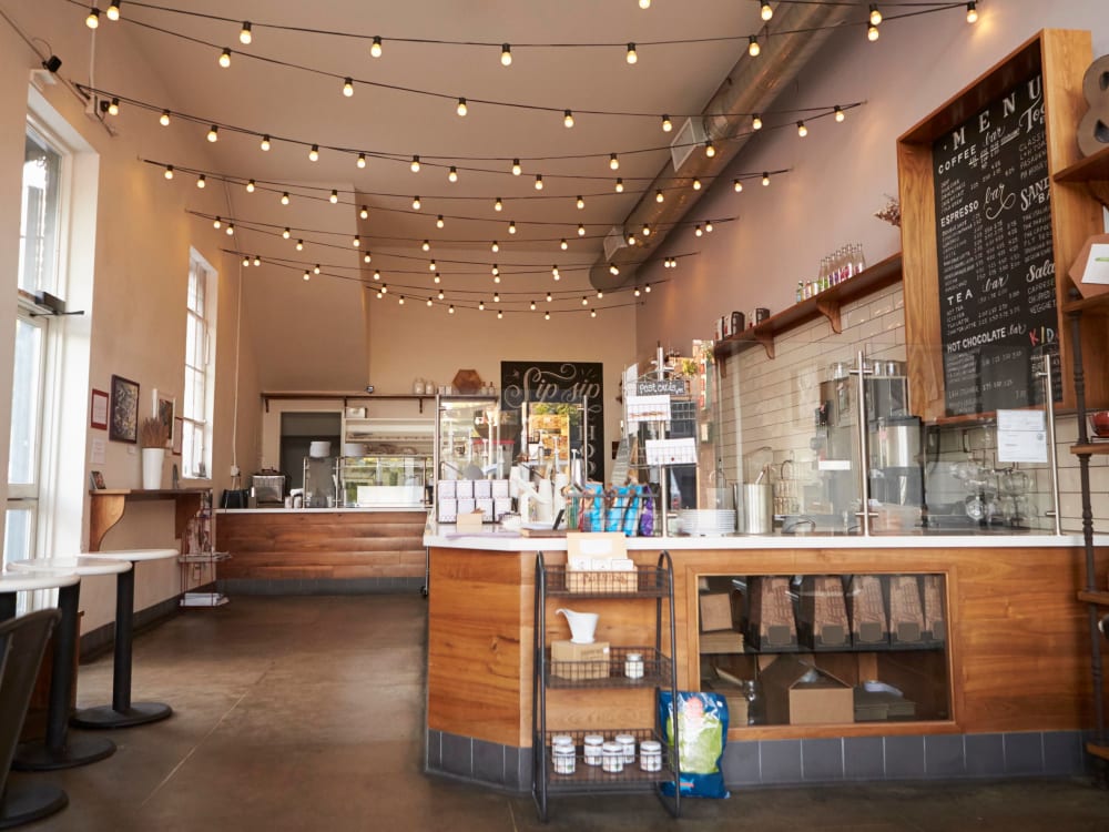 Ground-floor retail area with a cafe near Knoll at Fair Oaks in Fairfax, Virginia