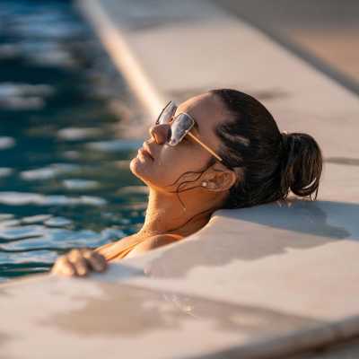 Resident by pool at Campbell Run Apartments in Woodinville, Washington 