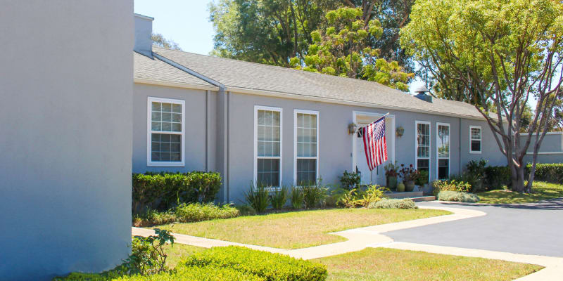 A home with an American flag next to the front door at Seal Beach Officer Housing in Seal Beach, California