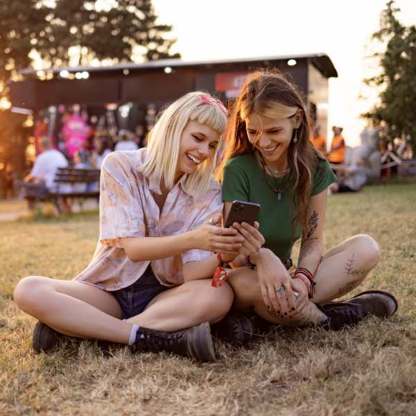 Girls looking at phone near Mayfair Reserve in Wauwatosa, WI