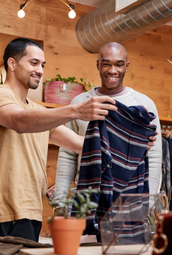 Residents shopping at a boutique near Riverside Towers Apartment Homes in New Brunswick, New Jersey